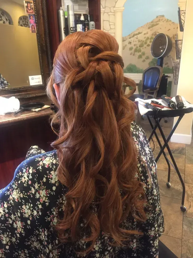 A woman is getting her hair done in a salon