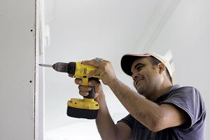 Man Doing Works at Home with Drill — Cleveland, OH — Trademark Carpentry Service