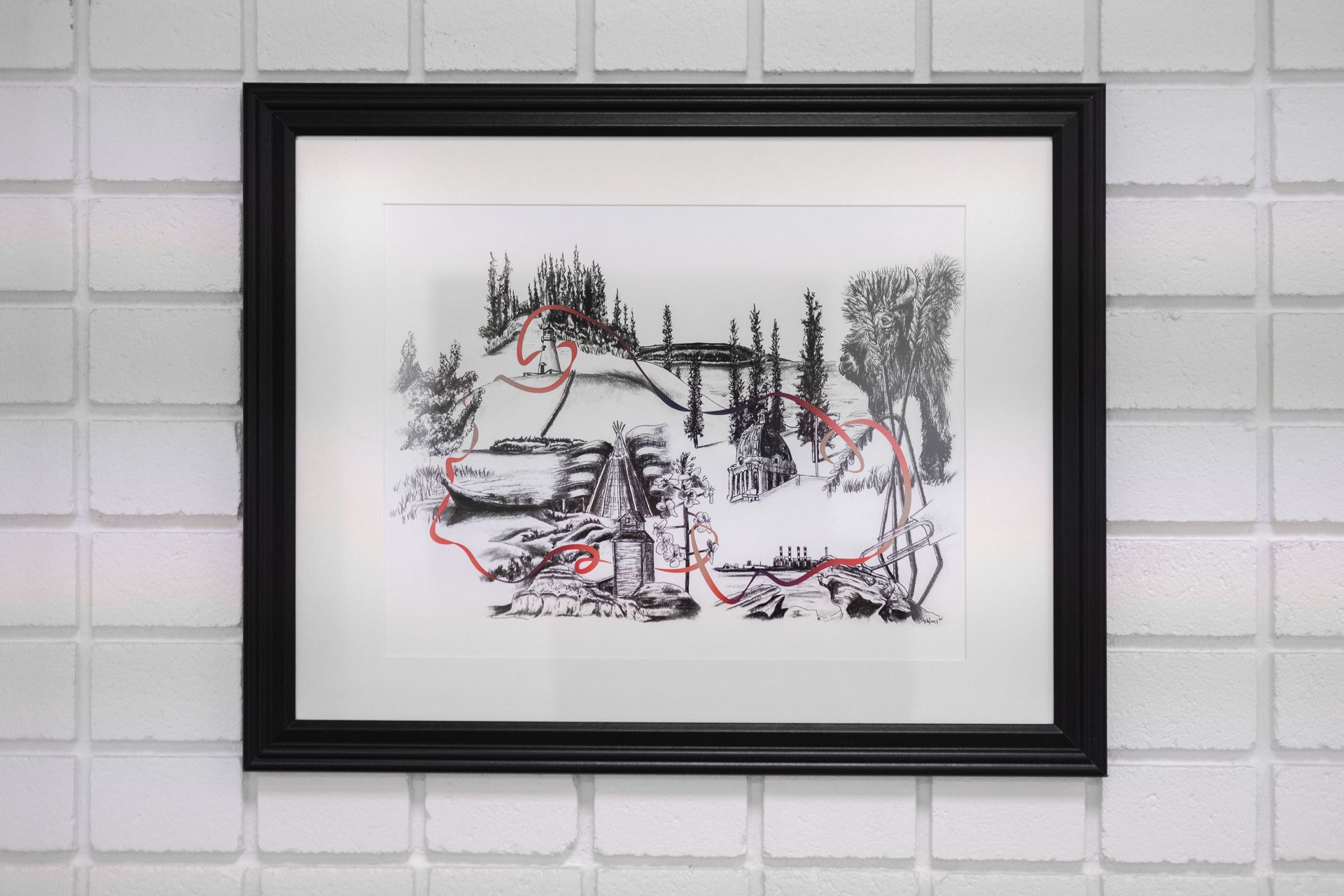 A framed painting is hanging on a white brick wall.