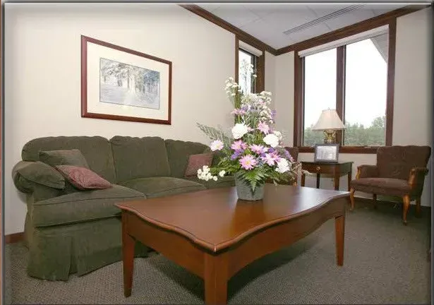 A living room with a couch and a coffee table