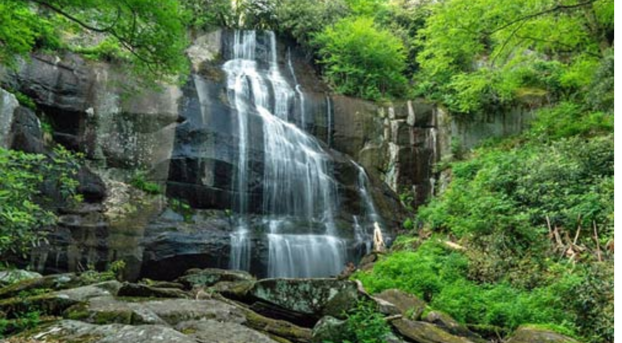 Aerial shot of Downtown Knoxville Tennessee with the gold World Fair Tower Ball rising above the town