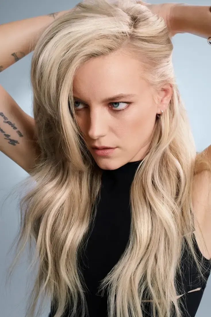 a young boy wearing red glasses and a blue suit