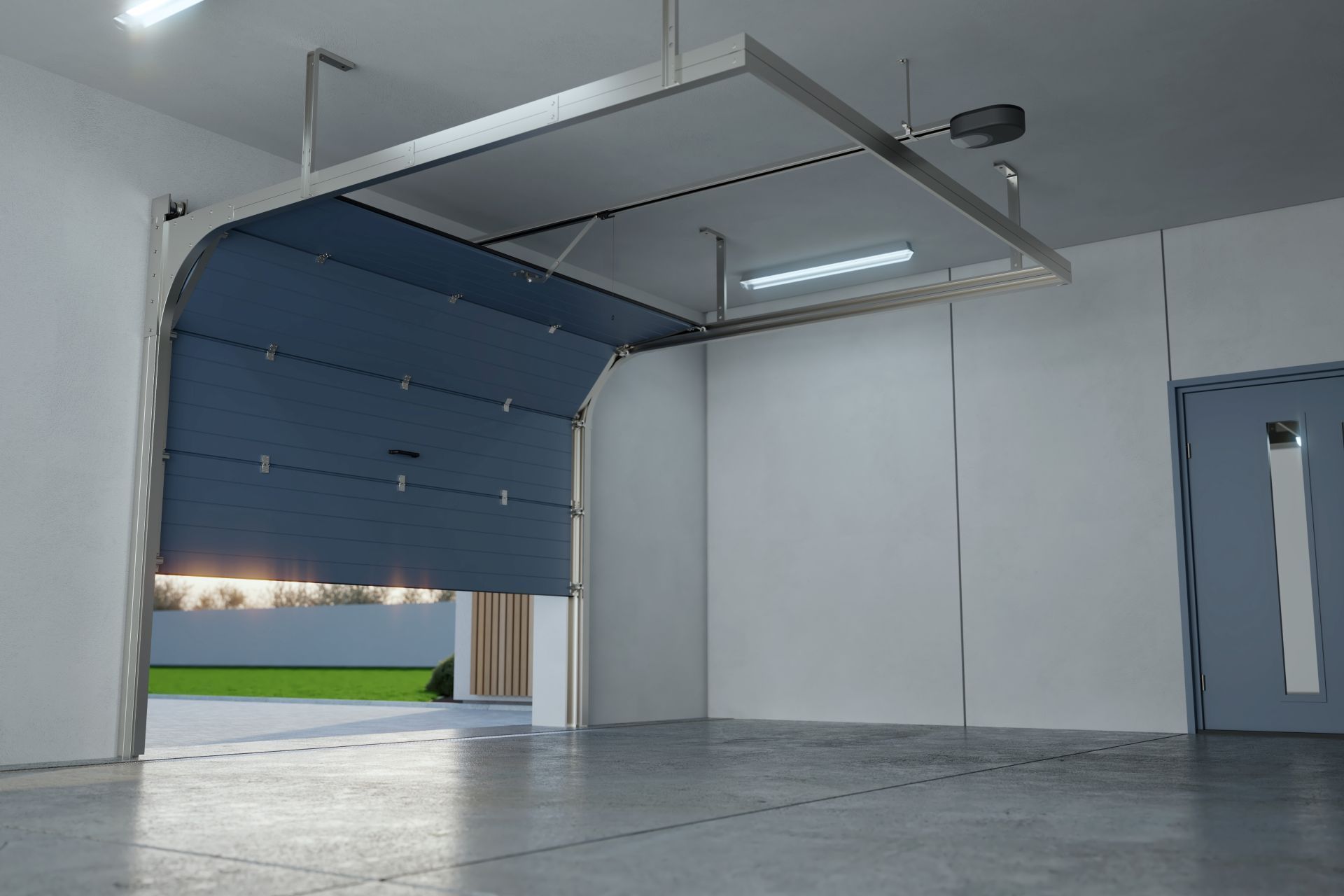 Blue garage door opening, with a light bar above. Interior view of a garage.