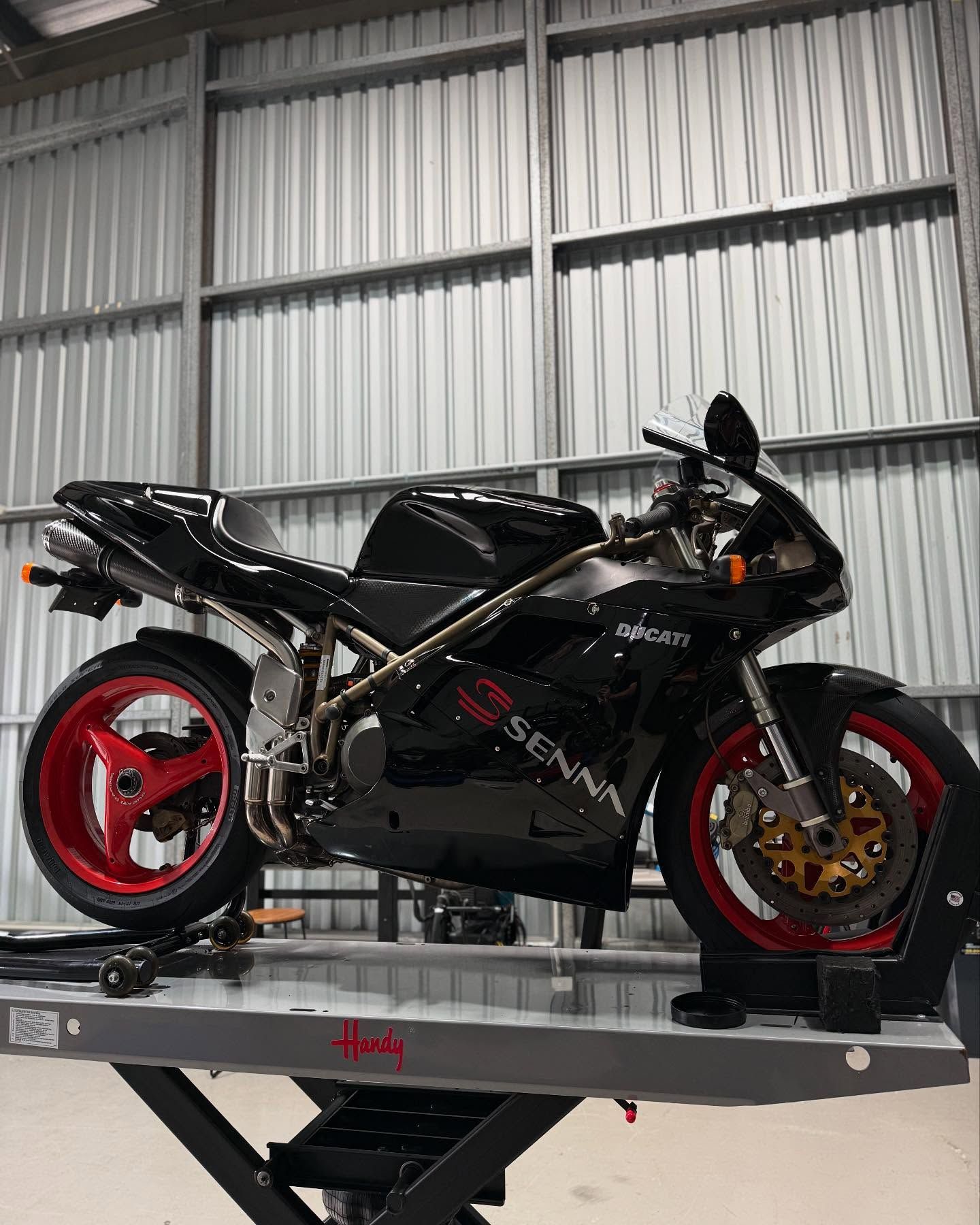 An iconic Ducati 916 Senna on the workshop bench at DUC LAB.