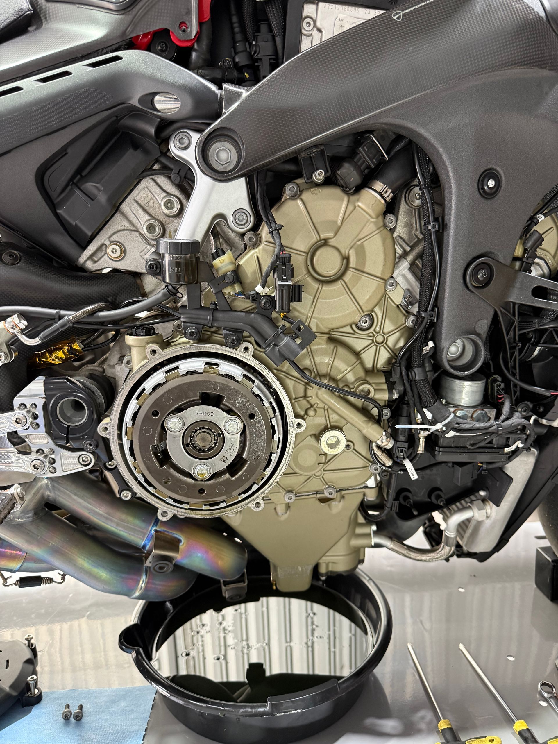 The side of a Ducati motorcycle with covers removed.