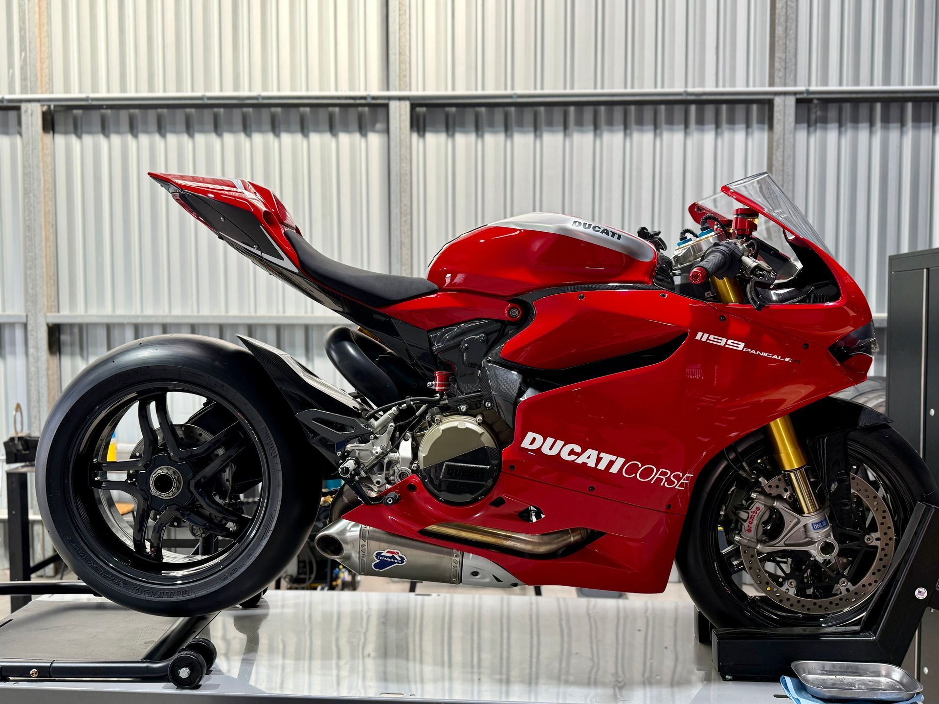 A Ducati 1199R Panigale mounted to the workshop bench at DUC LAB.