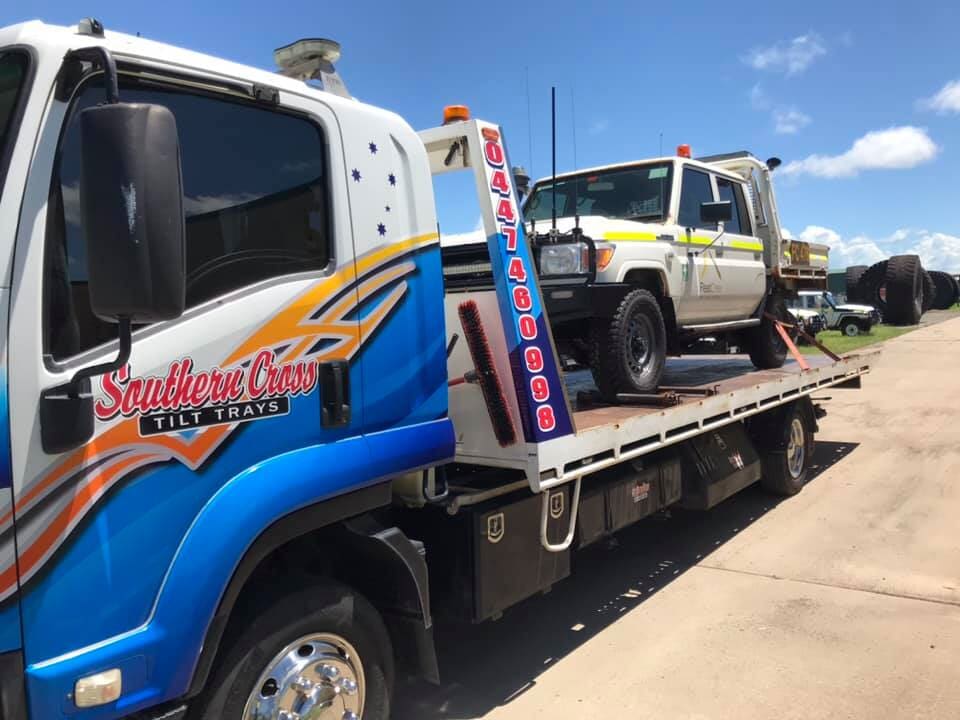 A Blue Van is Sitting on Top of a Tow Truck — Southern Cross Tilt Trays in Sarina, QLD