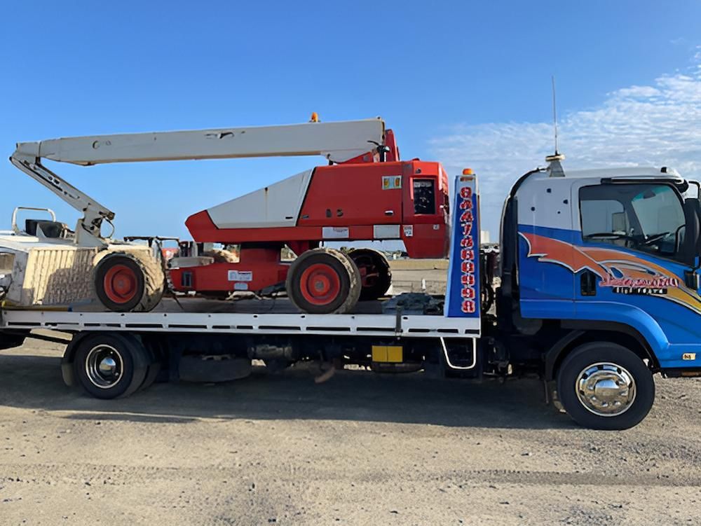 A Tow Truck With a Crane on the Back of It — Southern Cross Tilt Trays in Moranbah, QLD