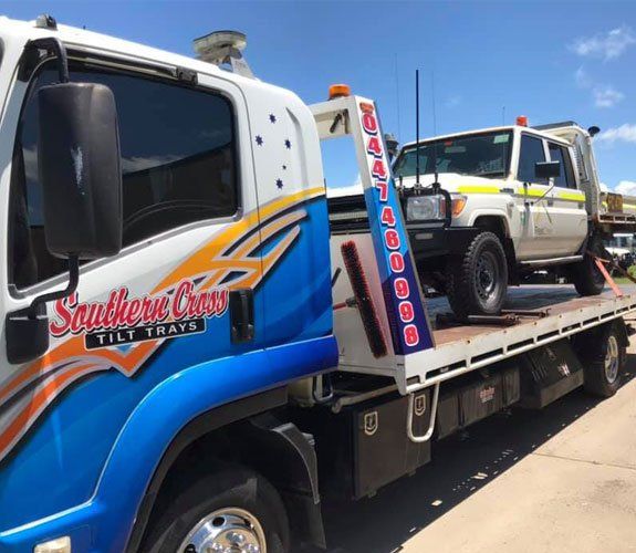 A Blue and White Tow Truck With the Word Southern Cross on It — Southern Cross Tilt Trays in Andergrove, QLD