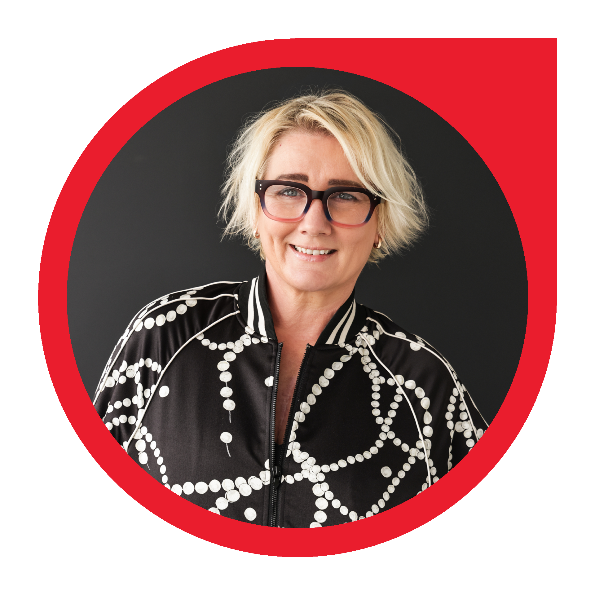 Woman with glasses smiles; framed in a red circle on a white background.