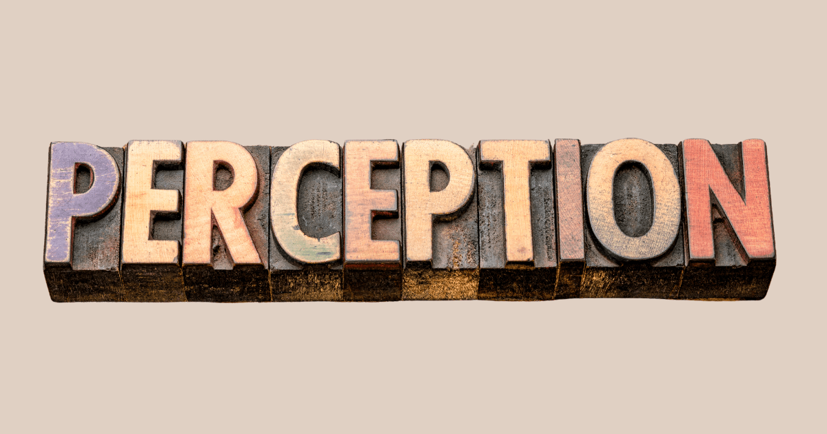 3D wooden word “PERCEPTION” in raised pinkish letters on a beige background