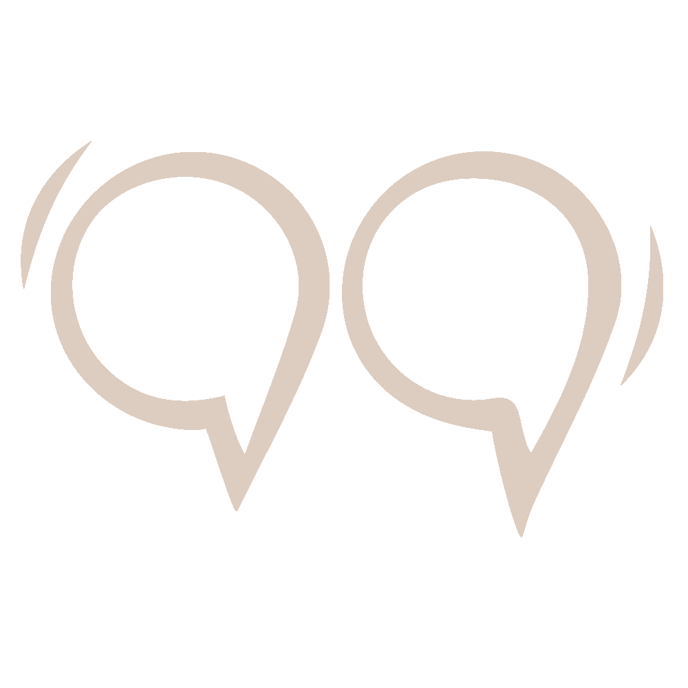 Coffee cup, planner, watch, and office supplies arranged on a white surface.