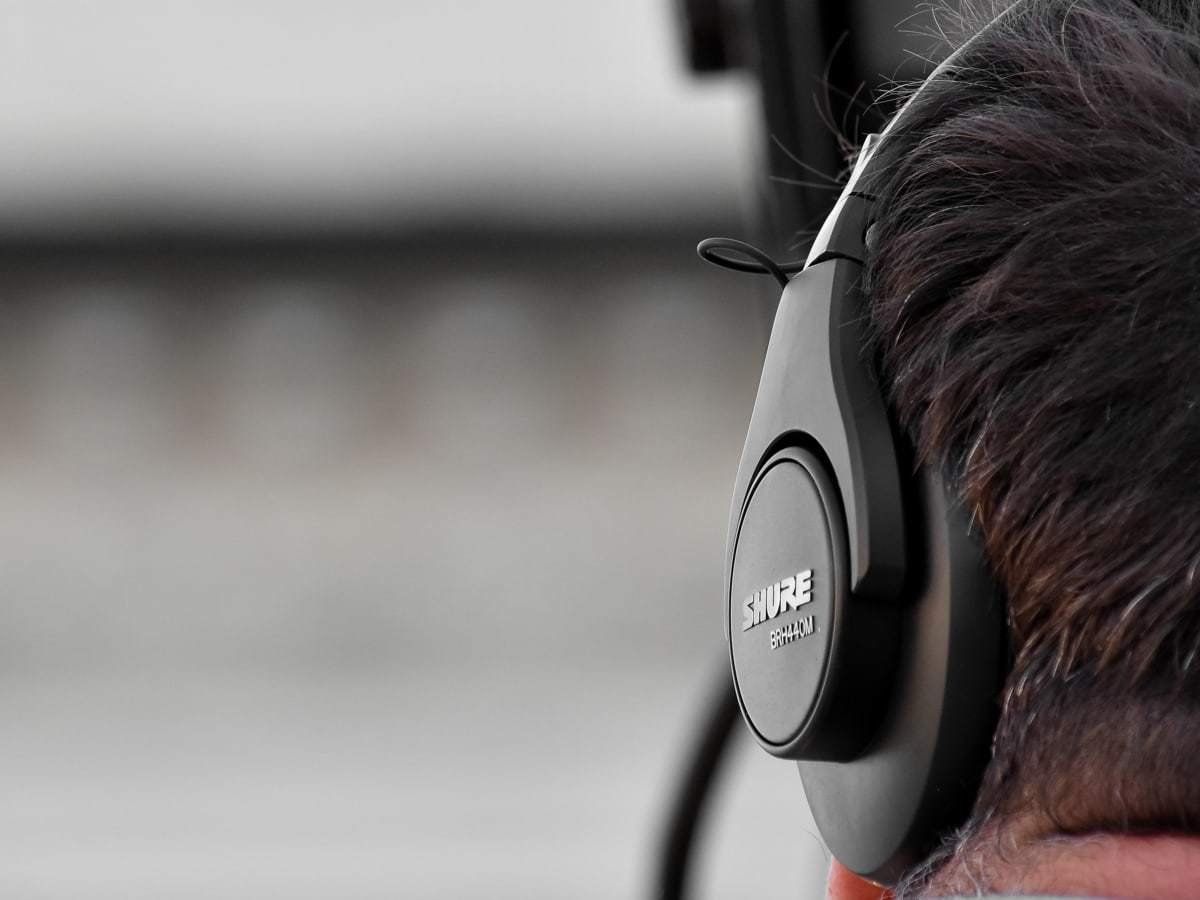 A close up of a person wearing headphones.