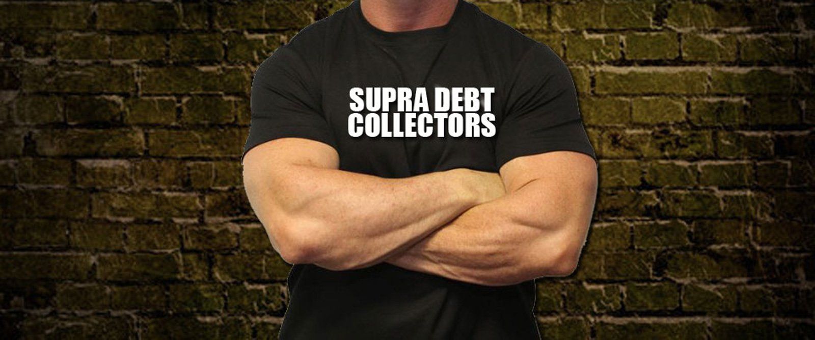 A man wearing a supra debt collectors t-shirt is standing with his arms crossed.