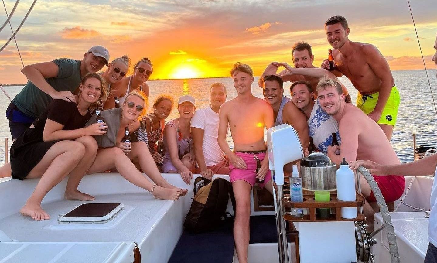 Blue Bay Bonaire Private Charter, group of happy people enjoying a private Sunset Sail Near Klein Bonaire