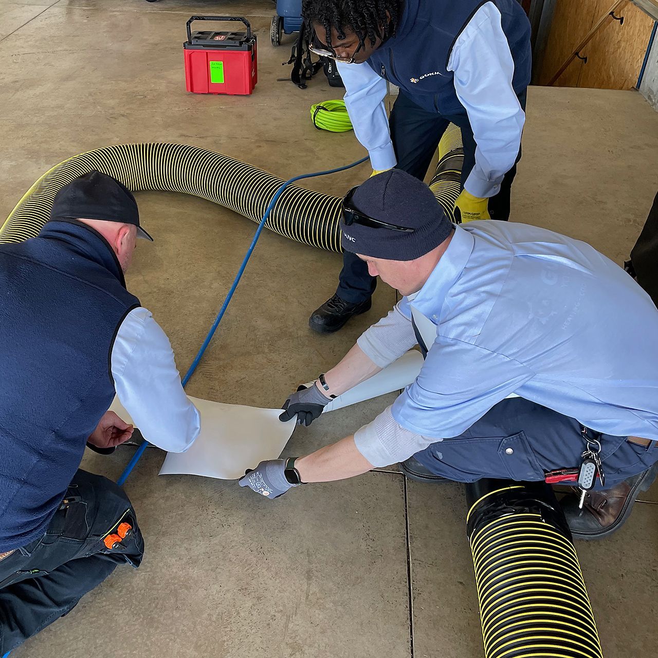 Gorjanc Home Service technicians prepare to clean the ductwork.