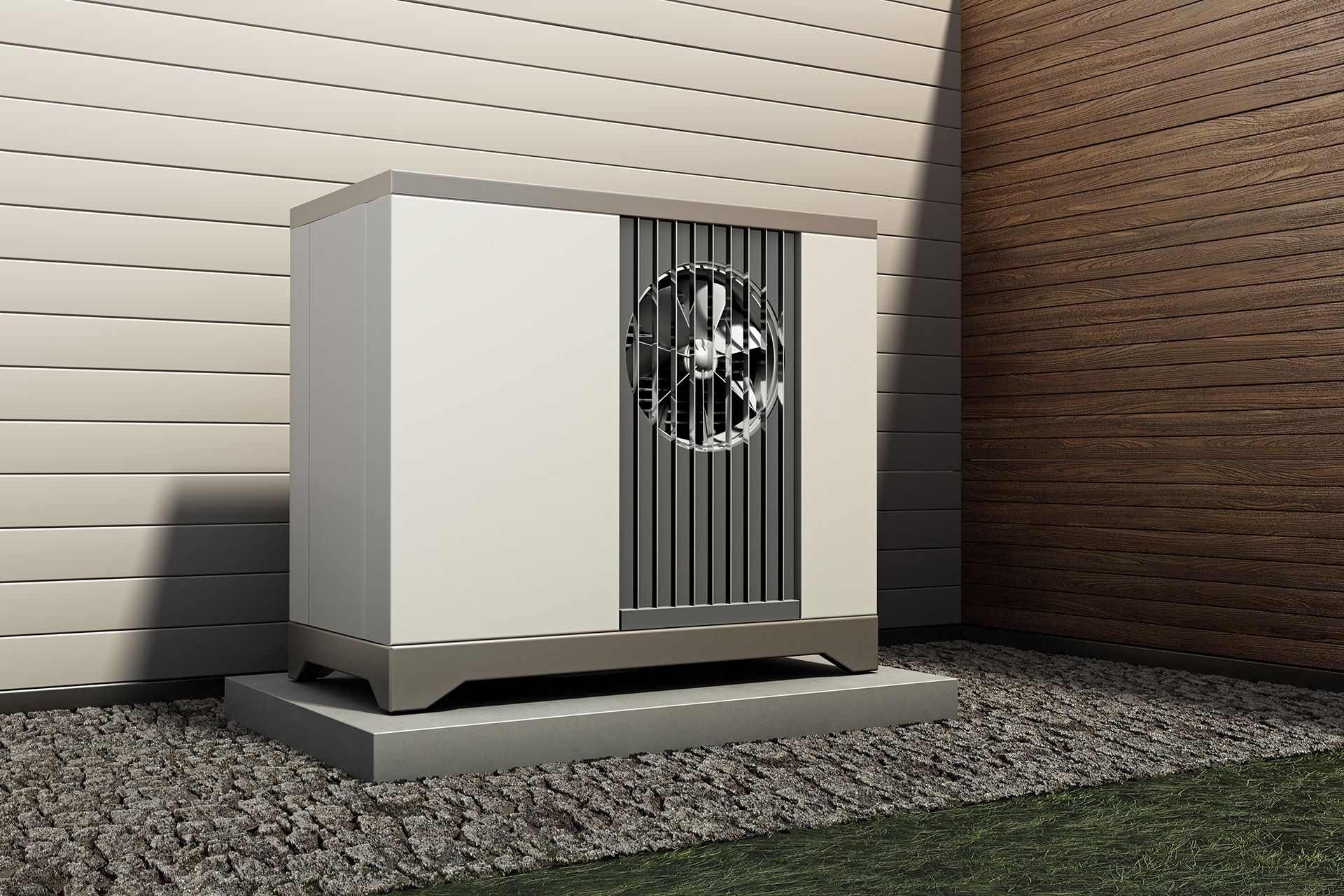 A heat pump is sitting in front of a brick wall