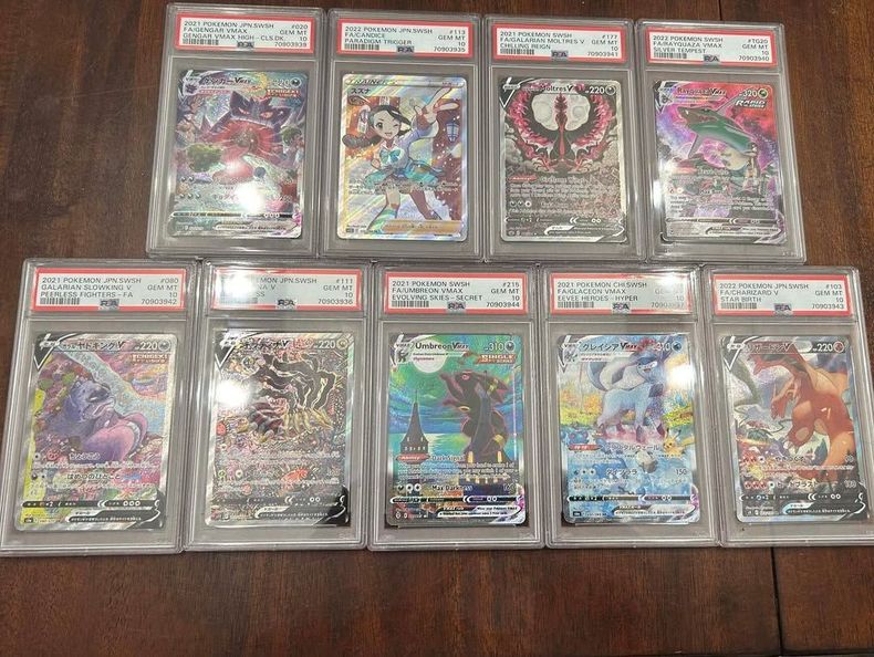 Rayquaza VMAX in PSA 10, Charizard EX in PSA 10, Umbreon VMAX in PSA 10