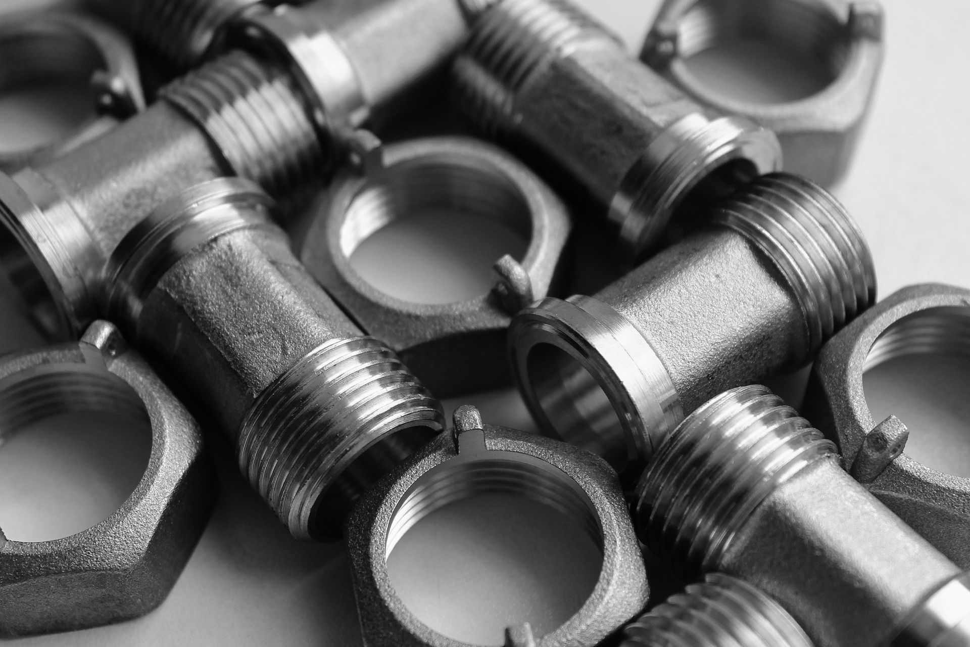 Two Construction Workers Are Working on a Pipe