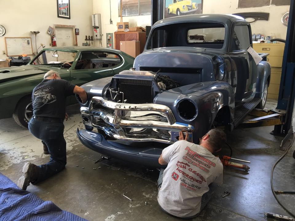Frame Off Restoration — Worker Repairing an Old Vintage Car in Chico, CA