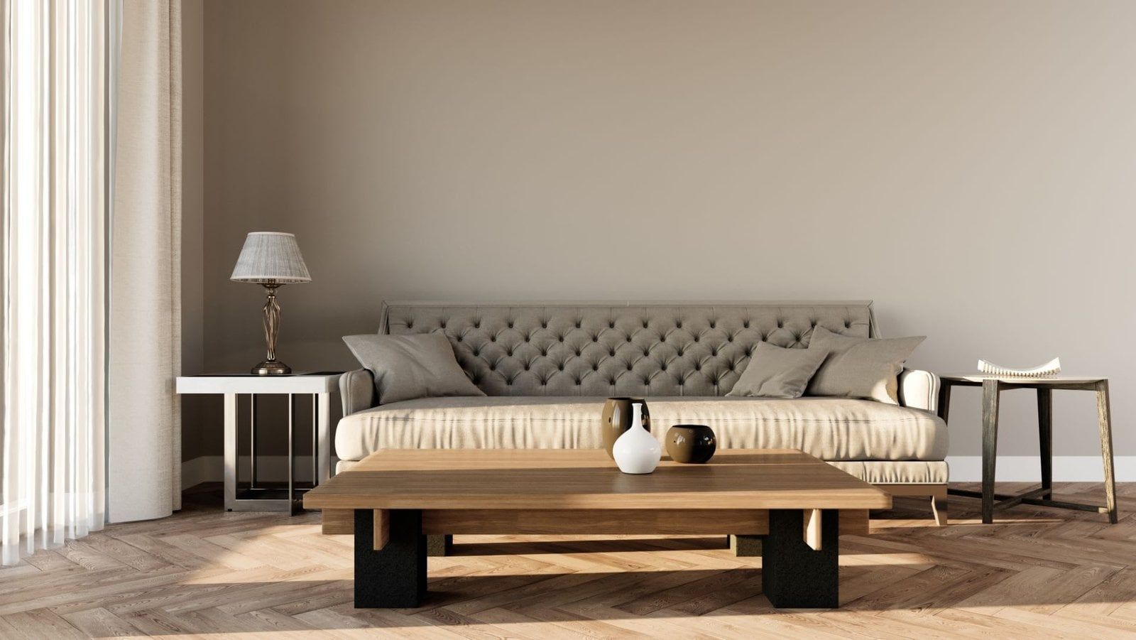 Living room with a tufted sofa, wooden coffee table, side tables, and sheer curtains.