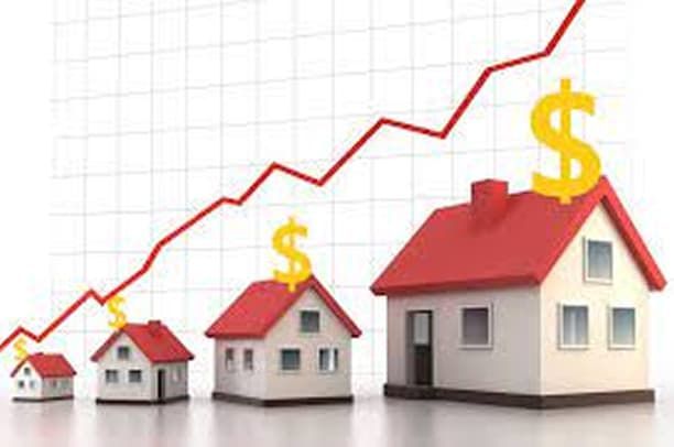 Houses of increasing size with dollar signs atop, a rising red line represents growing value.