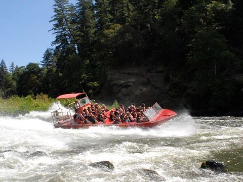 Jetboat running through a rapid on the Rogue River