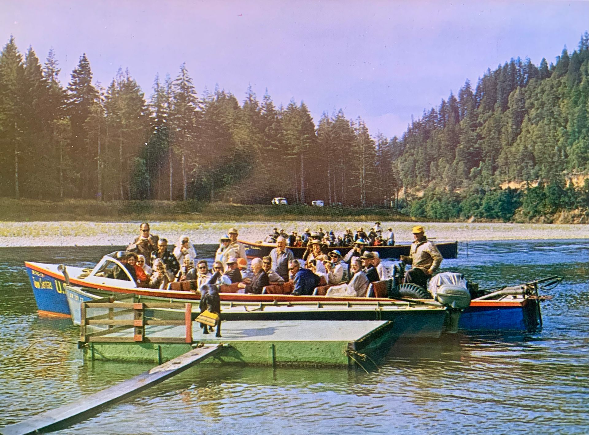 a group of people on a boat parked at a dock