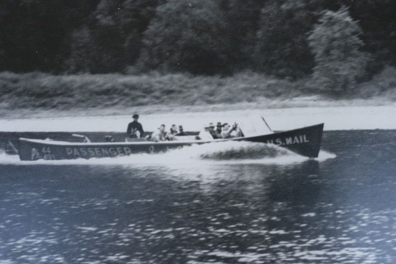 a black and white photo of a US mail boat