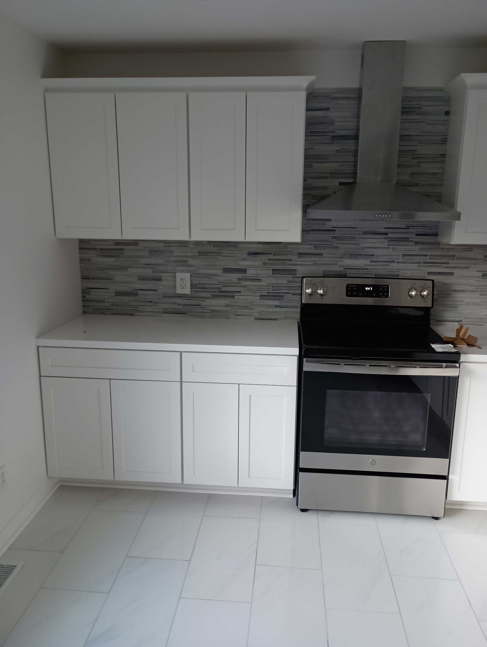 White Cabinets And Stainless Steel Appliances — Knoxville, TN — DABZ CO LLC Electrical & Building Contractors