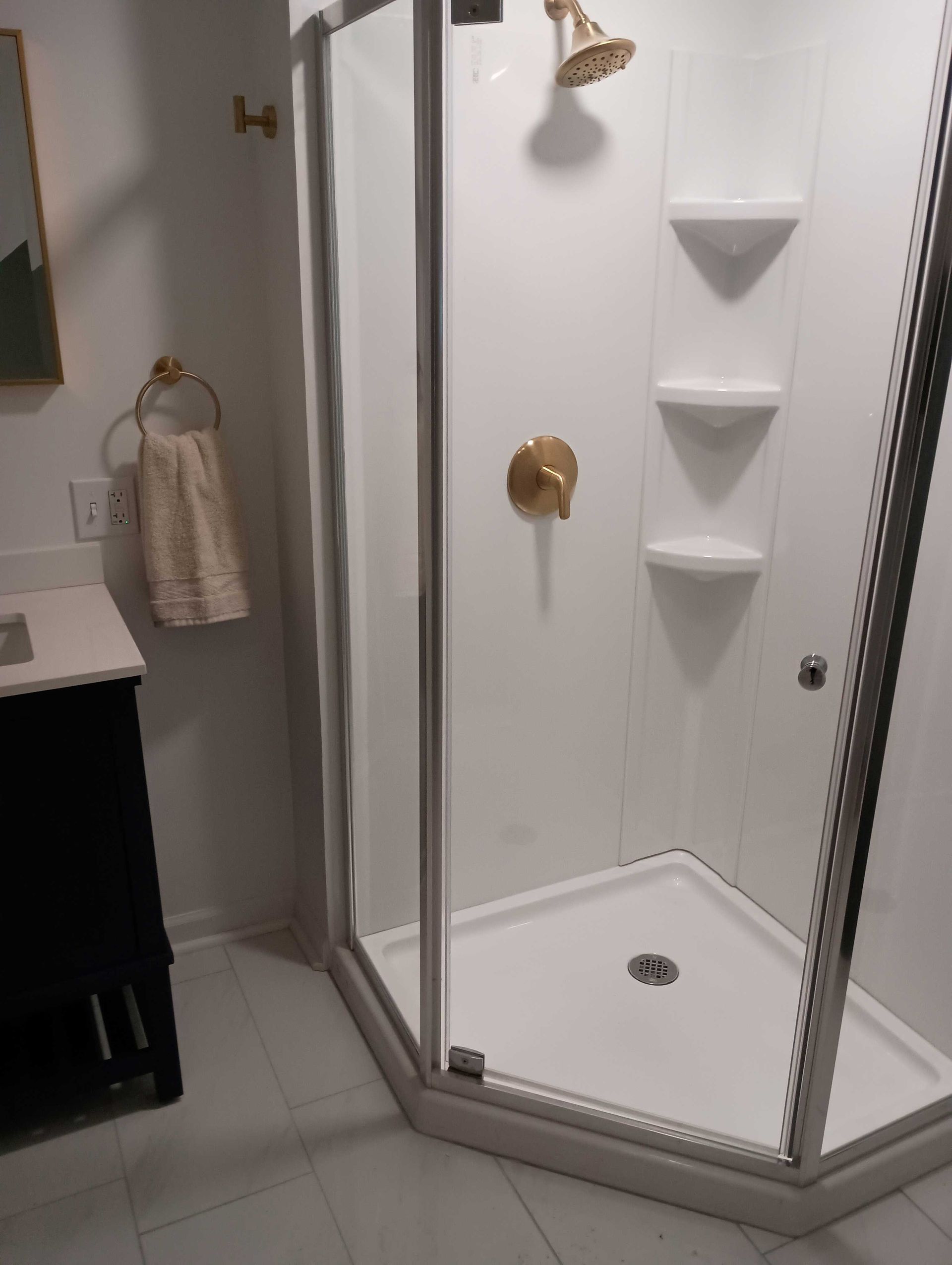 A Bathroom With A Walk In Shower And A Sink — Knoxville, TN — DABZ CO LLC Electrical & Building Contractors