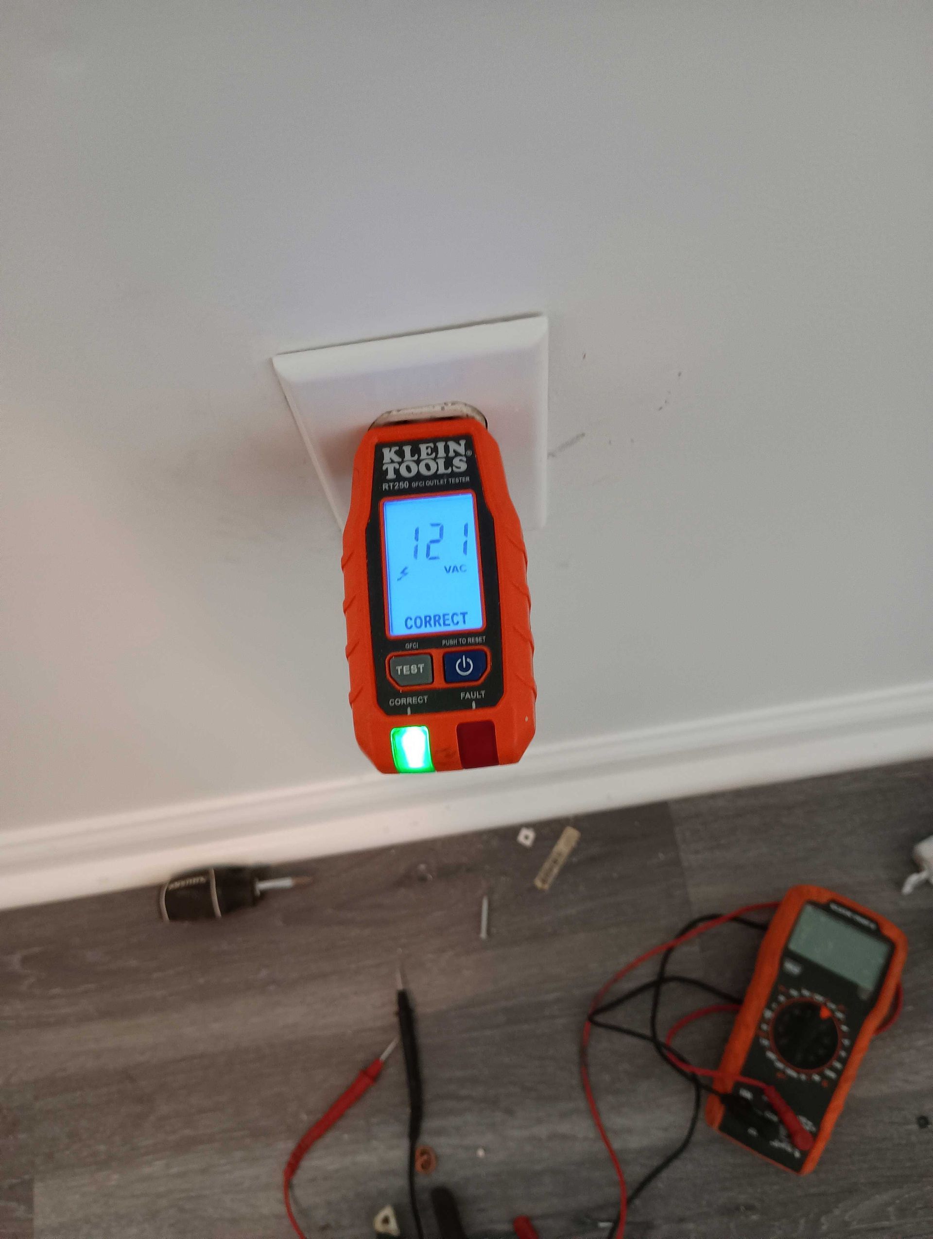 Digital Multimeter Is Plugged Into A Wall Outlet — Knoxville, TN — DABZ CO LLC Electrical & Building Contractors