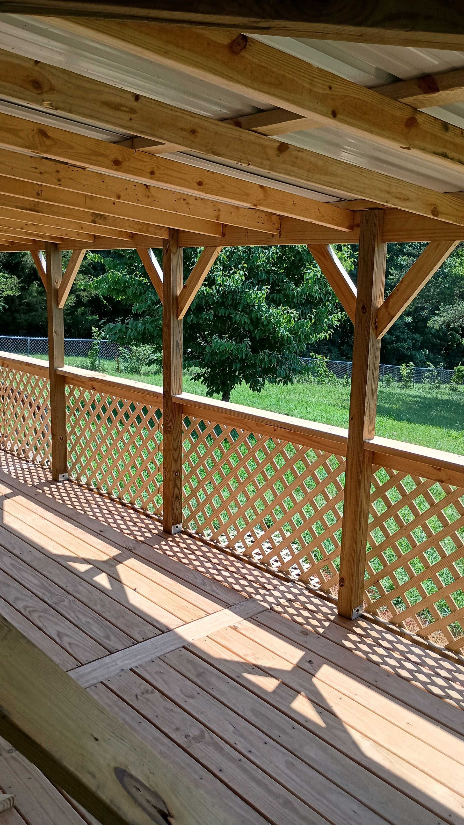 Wooden Deck With A Lattice Railing — Knoxville, TN — DABZ CO LLC Electrical & Building Contractors