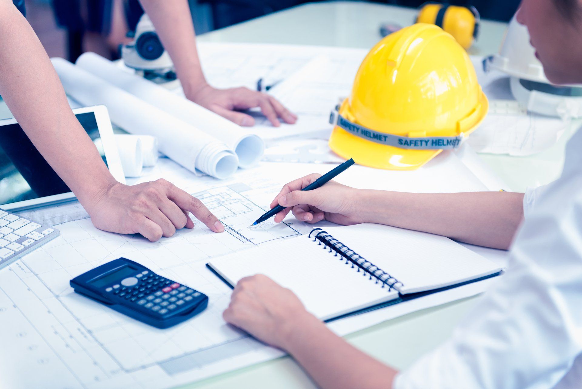 two construction contractors completing construction accounting