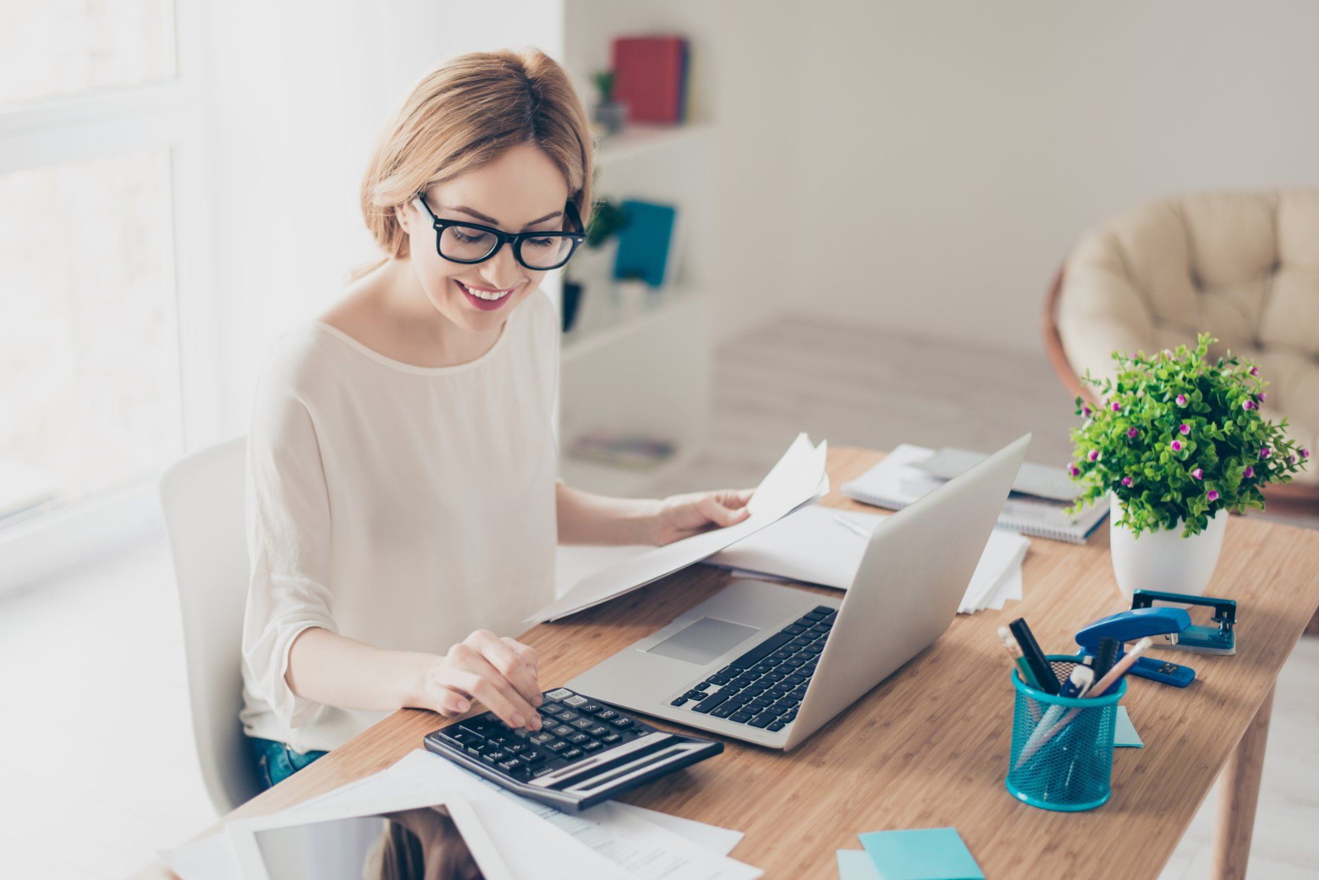 Women creating statement of functional expenses for her nonprofit