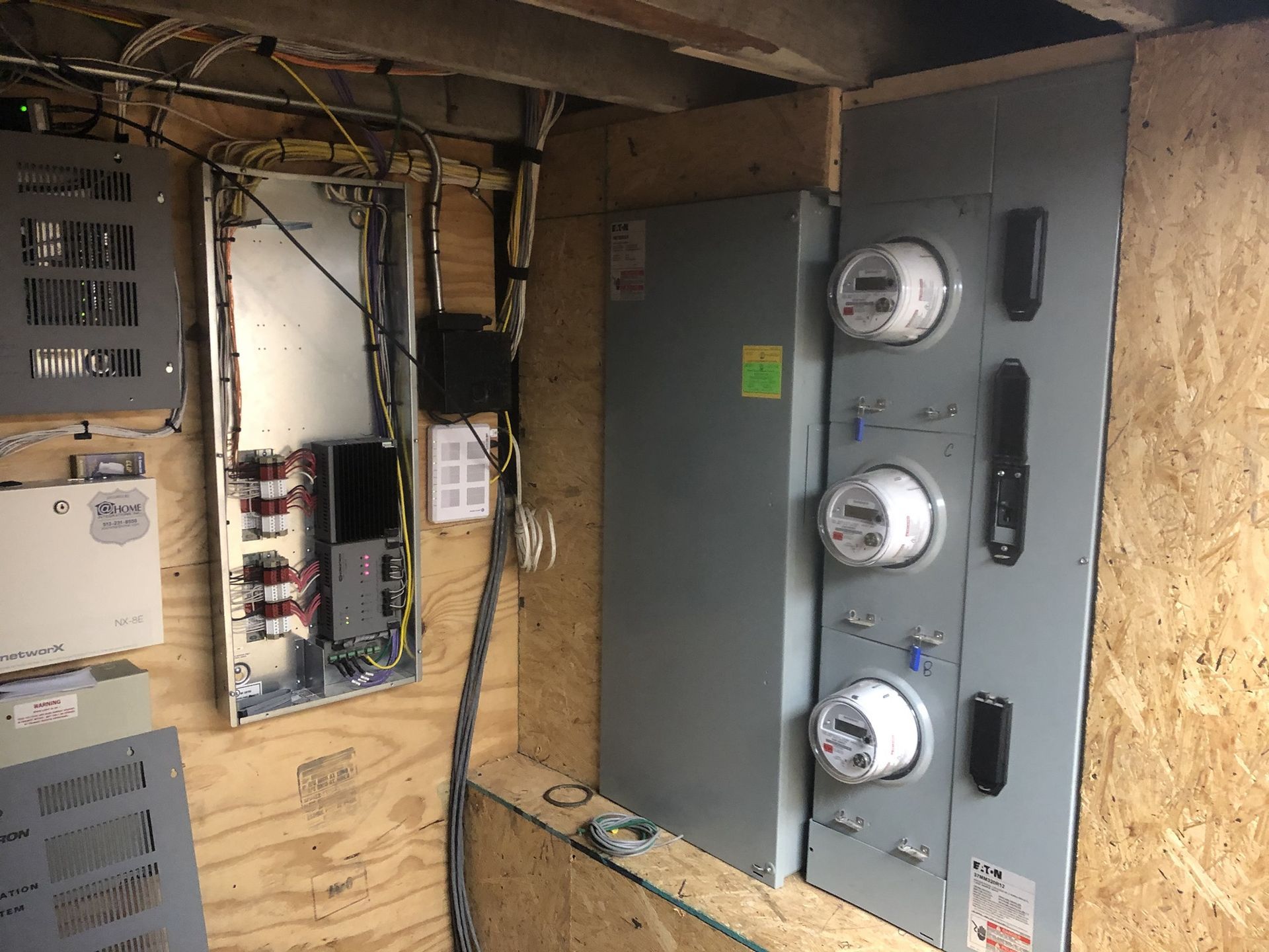 A room with a lot of electrical equipment on the wall.