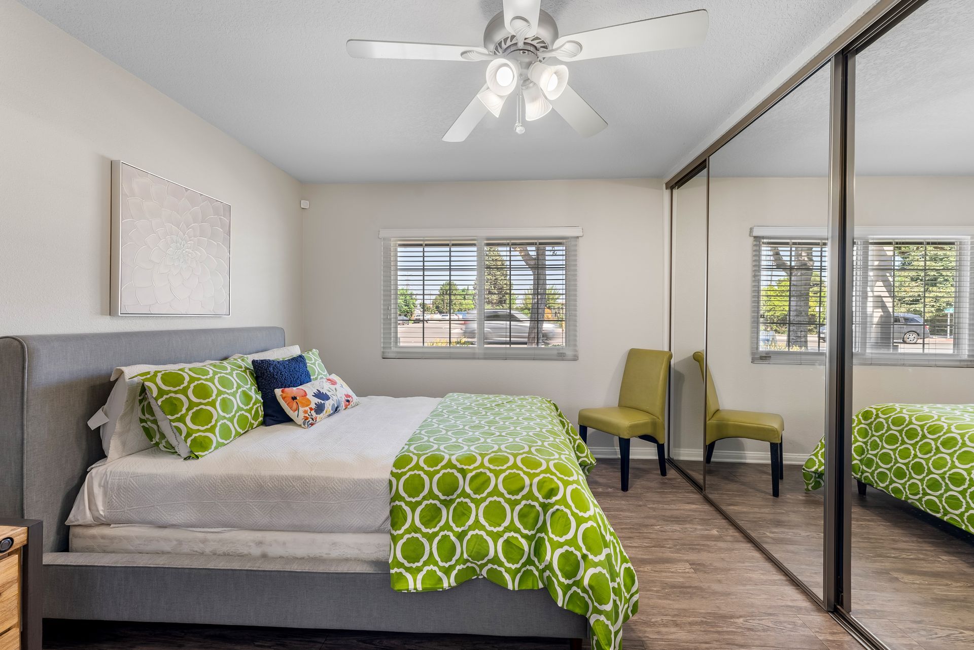 Bedroom with bed, chair, and window