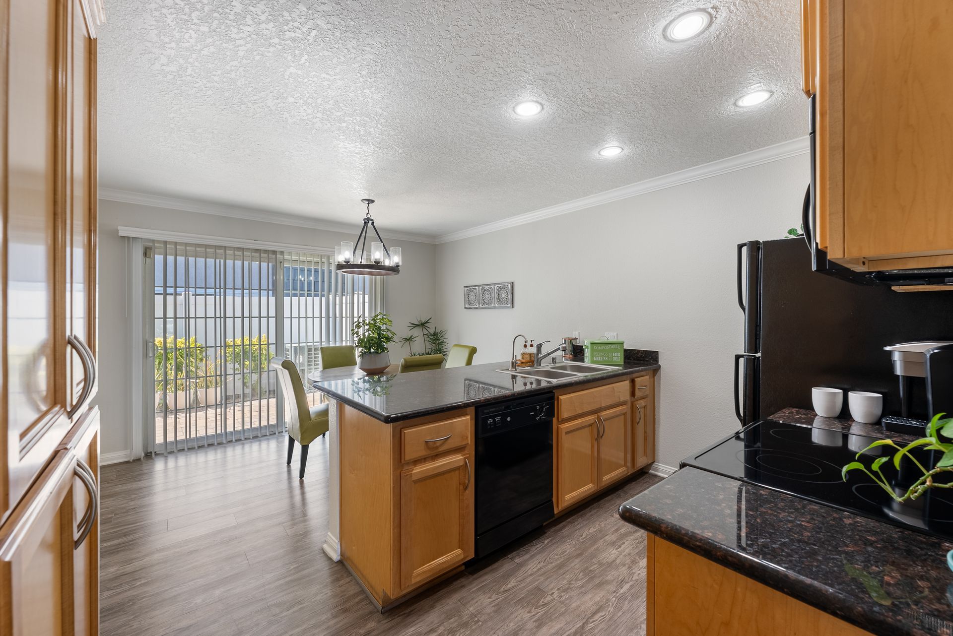 Furnished kitchen with sink and dishwasher