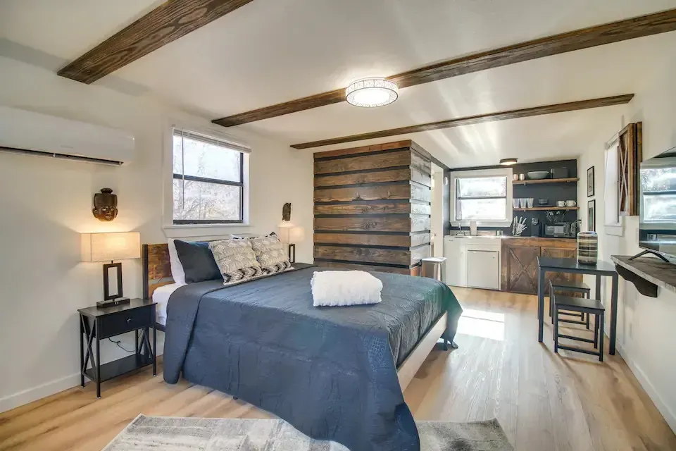 There is a large bed in the middle of the room.