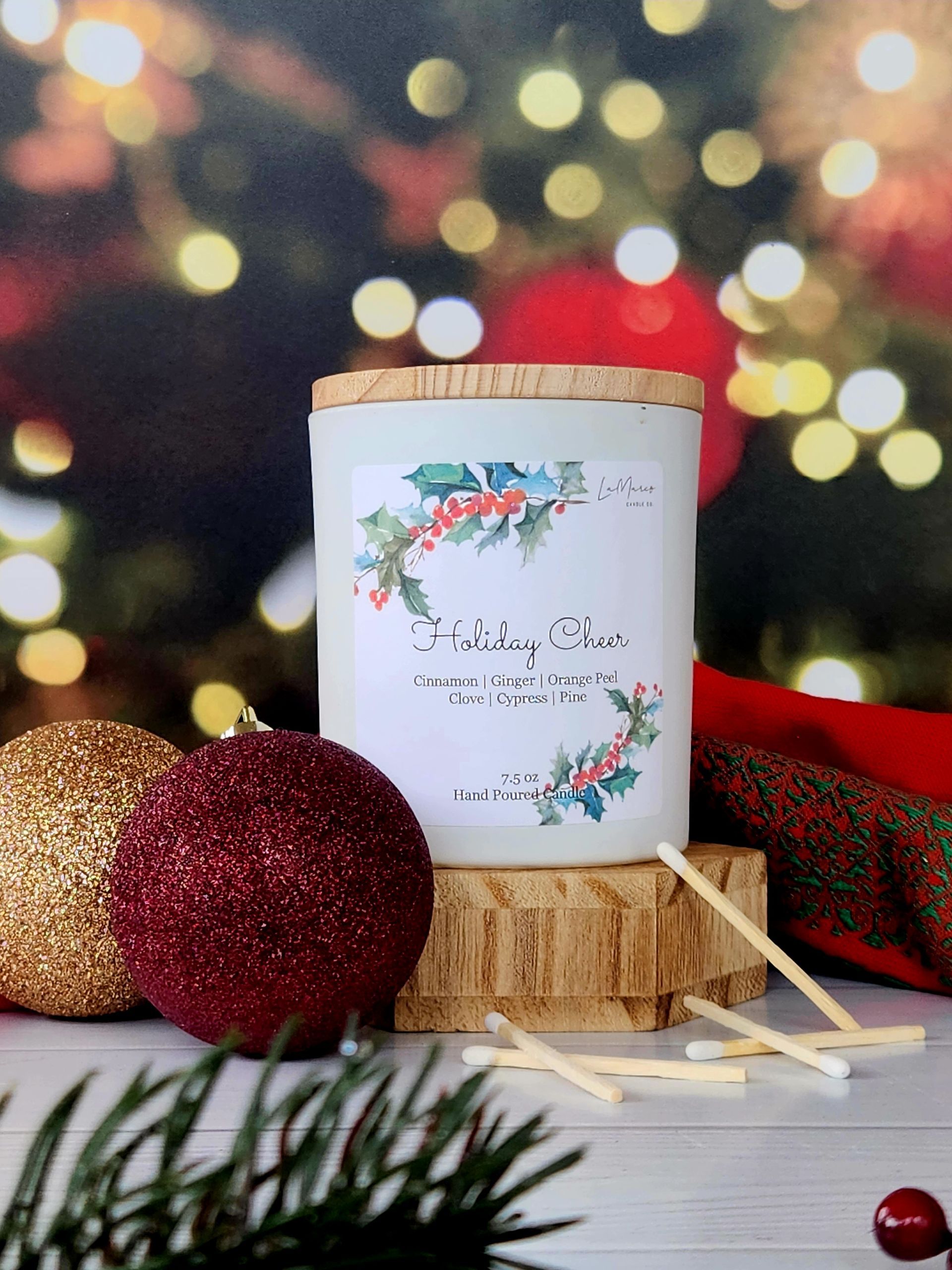 White and orange pumpkin-shaped ceramic containers with gold accents on a reflective orange surface, autumn-themed.