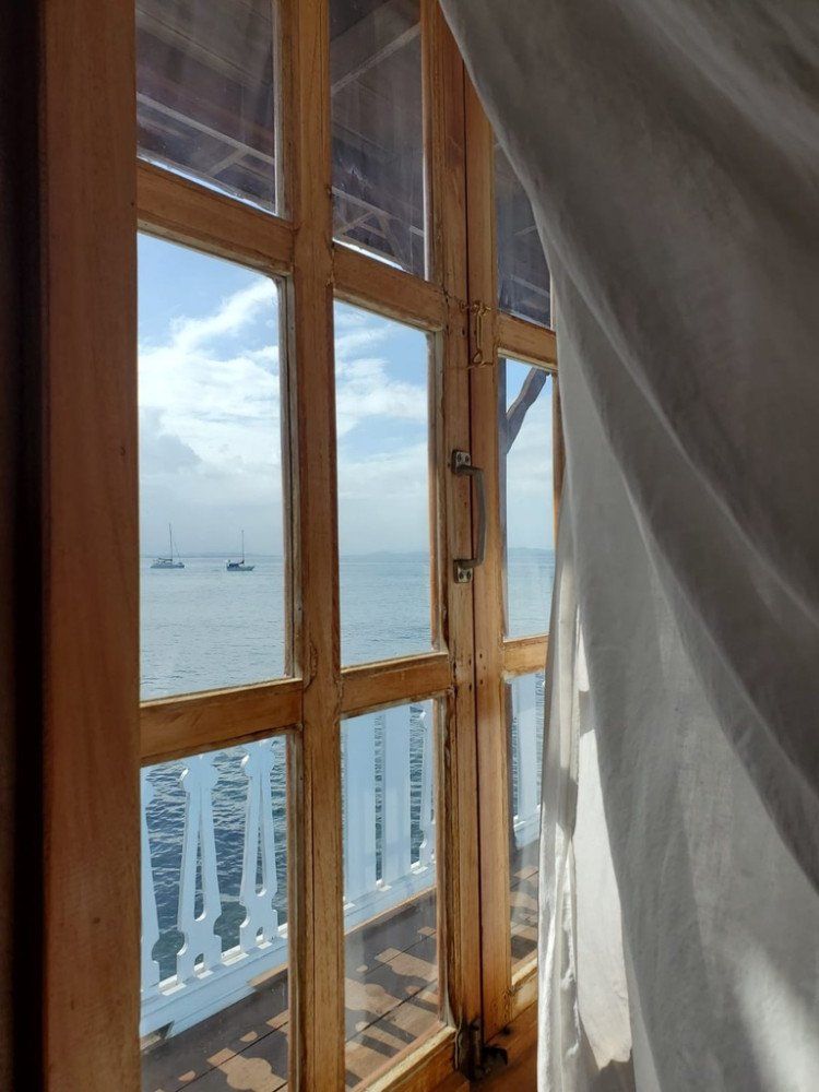 A large window with a view of the ocean