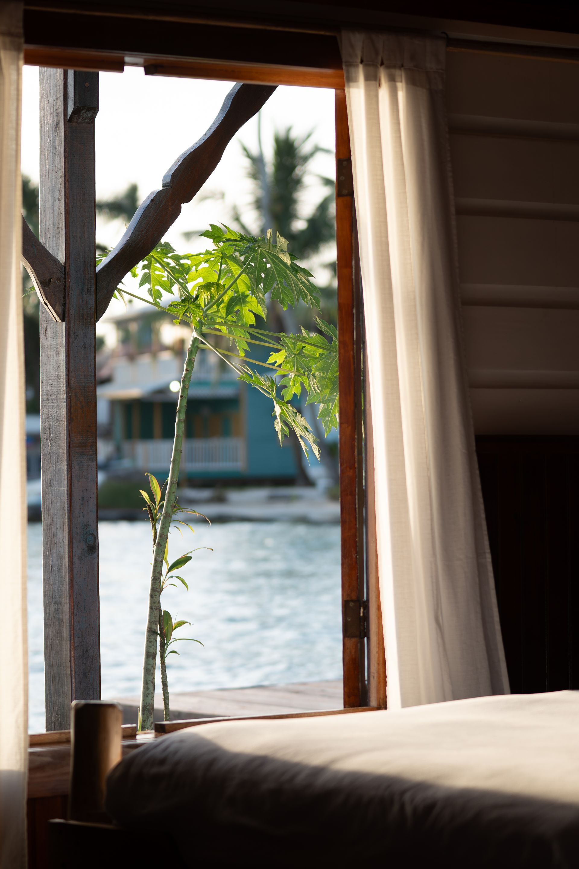 A view of a body of water from a bedroom window