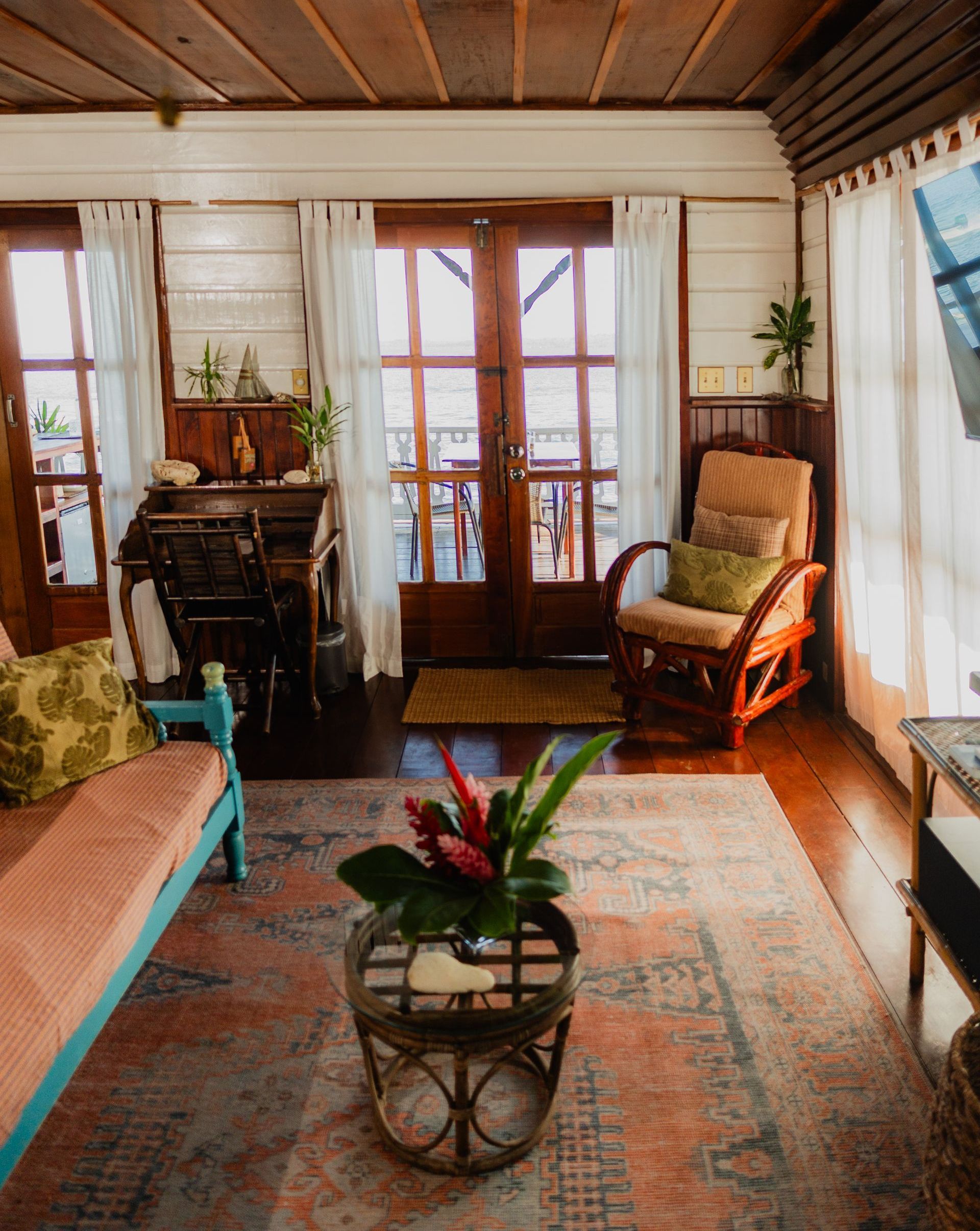 A living room with a couch a chair and a coffee table