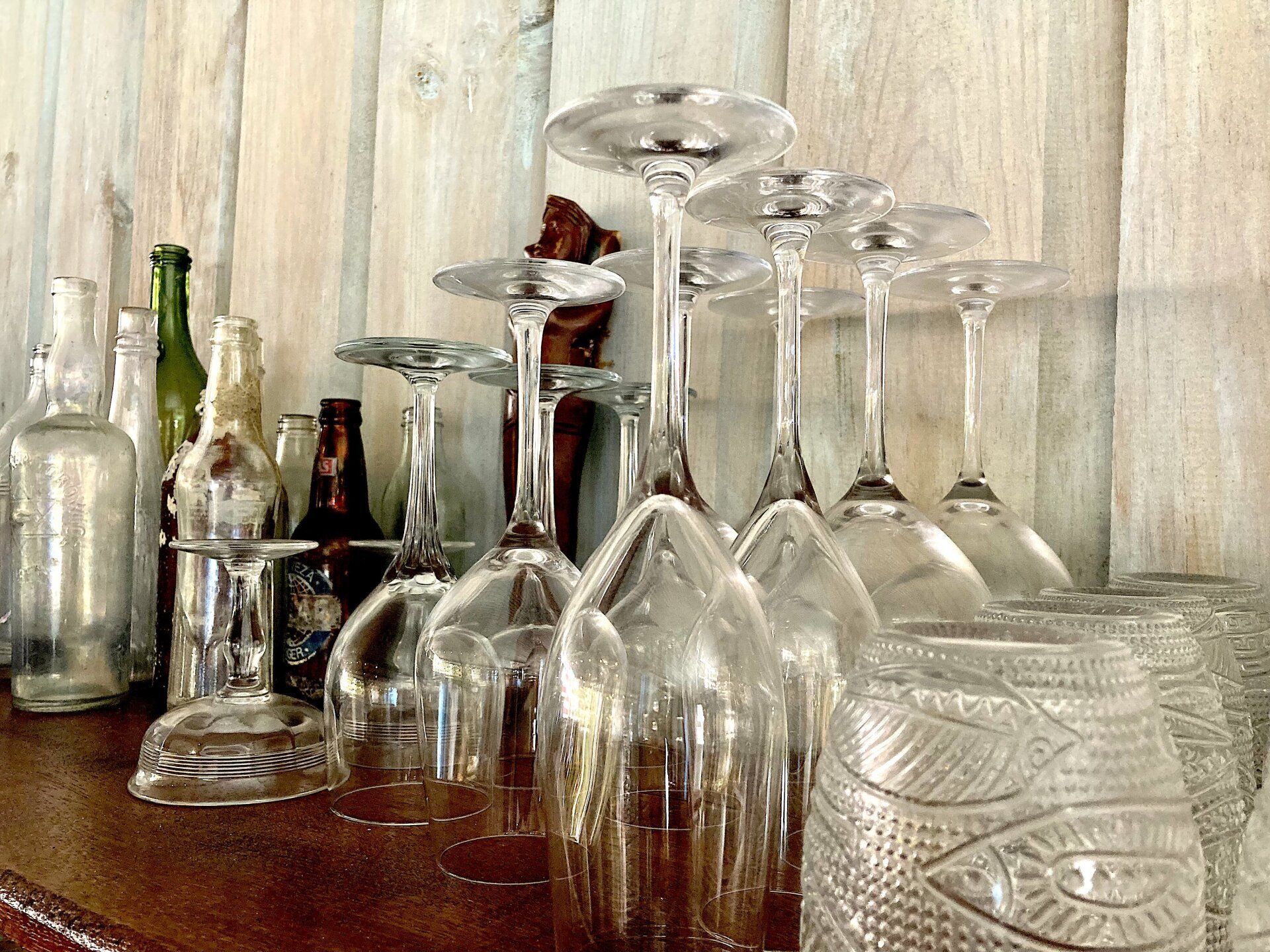 A bunch of wine glasses are sitting on a table