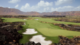 A person is standing on a golf course with golf balls and a golf club.