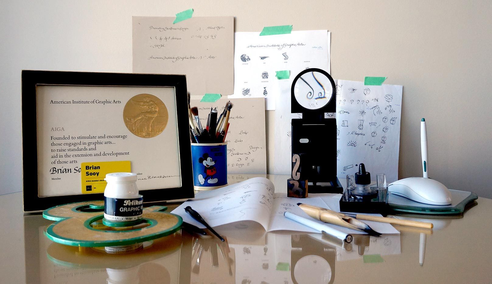 A desk with a bottle of glue on it