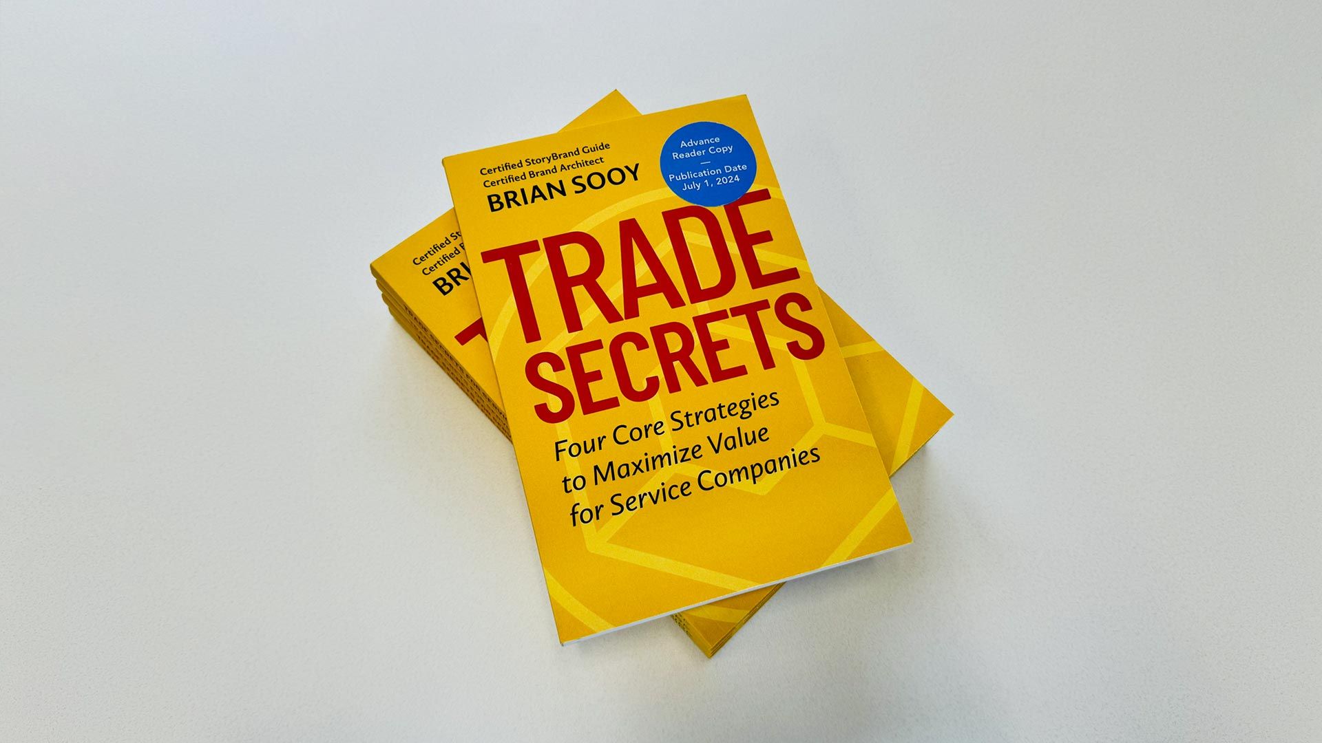 A book titled trade secrets is stacked on top of each other