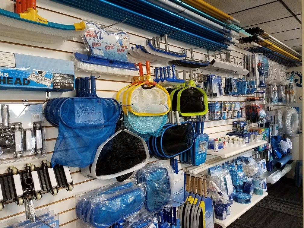 Pool supply store with tools and equipment on display.