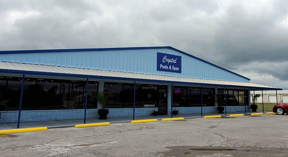A blue building with a sign that reads 