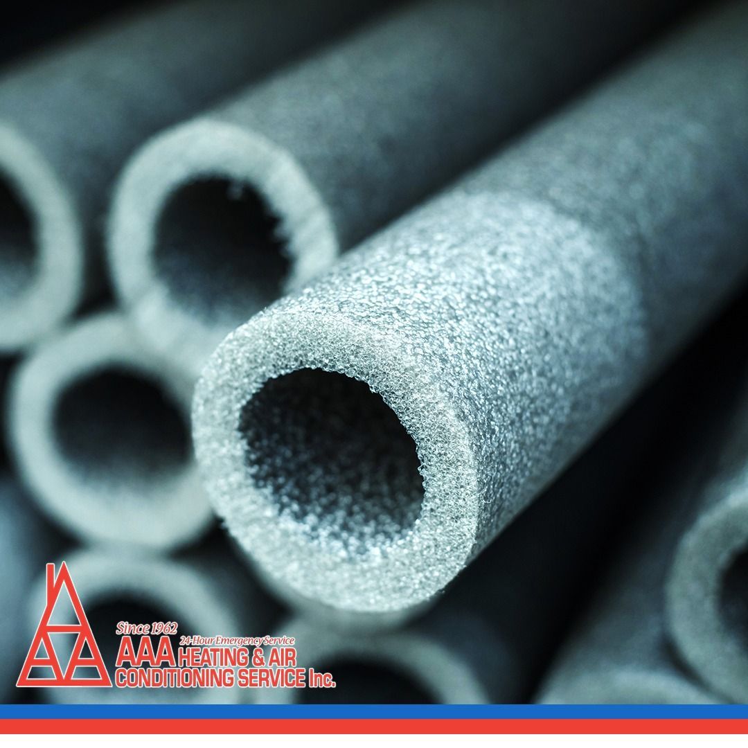 Gray, cylindrical insulation tubes with hollow centers, stacked together.